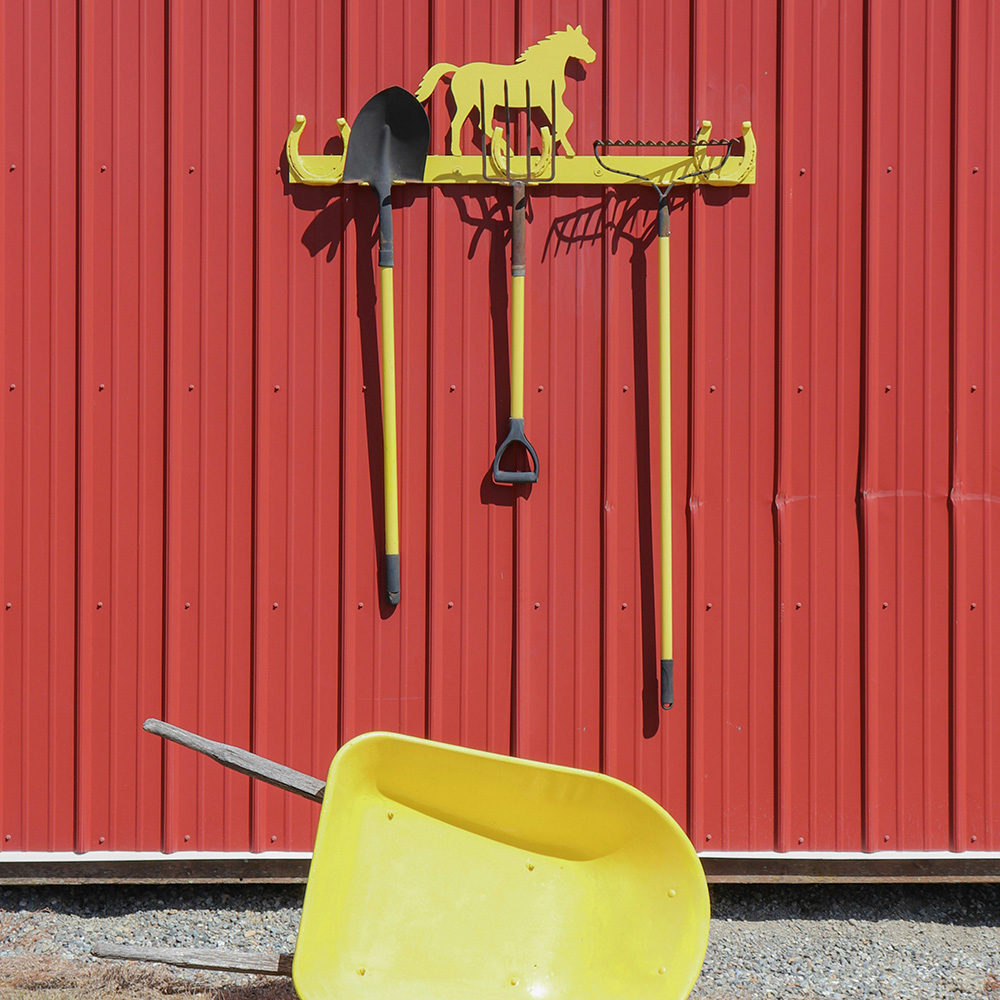 Photo of farm tools and a wheelbarrow by Jennifer Grismer on Unsplash